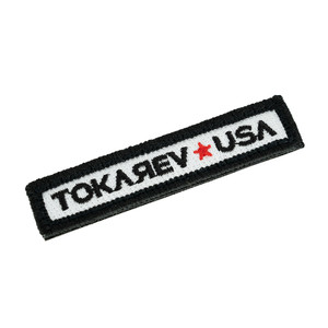 Close-up of Tokarev USA patch texture and stitching details Close-up of Tokarev USA patch texture and stitching details