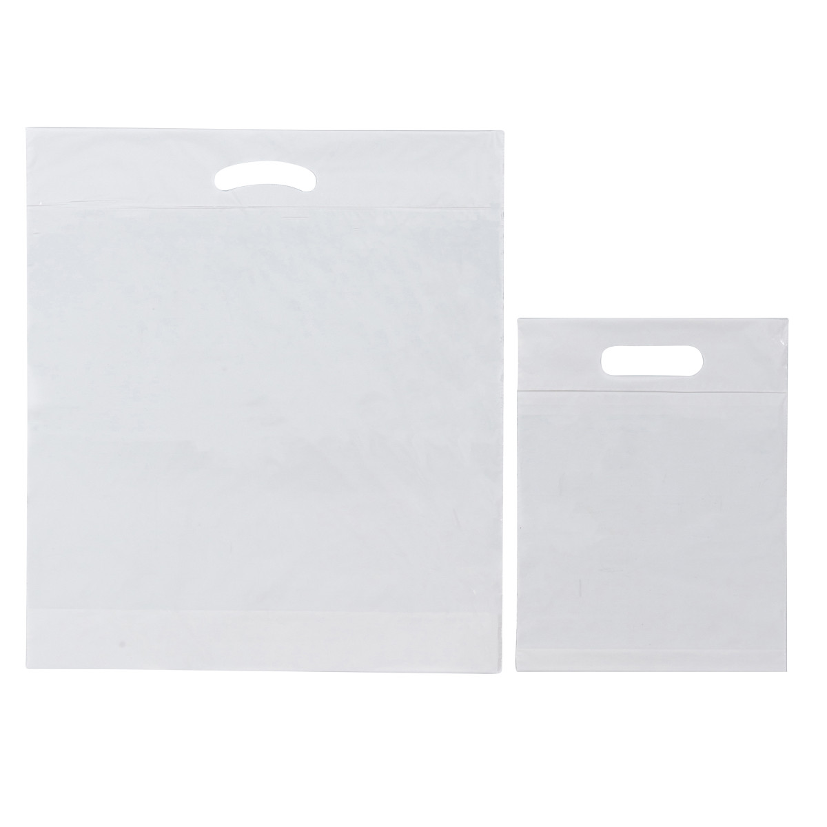 Image des sacs en plastique blancs à poignée découpée Image des sacs en plastique blancs à poignée découpée