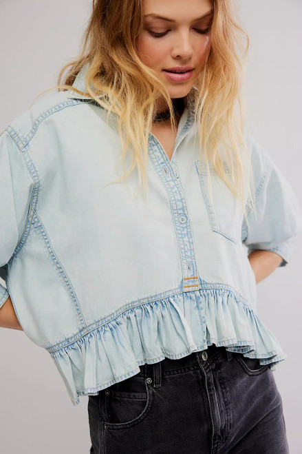 Voluminous puff sleeves and a ruffled hem bring a charming finish to this cropped denim peplum shaped from soft cotton.