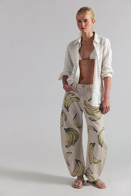 Our most-loved barrel jeans from our We The Free collection, now featured in a playful printed fabrication.

Fit: Mid-rise, slouchy, relaxed fit, wide-legs, ankle-length; this style runs slightly large so we recommend sizing down one size
Features: Button closure, rigid denim fabrication, belt loops at waistband, 4-pocket style, subtle distressing, tapered bottom hem, seam detail throughout