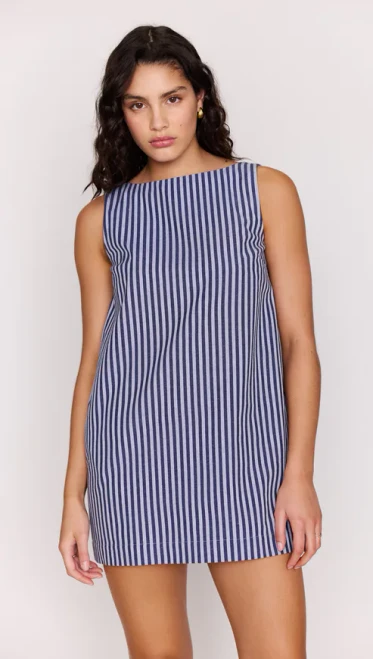 The Delmar Striped Mini Shift Dress is an easy, throw-on mini designed for warm days and effortless styling. Cut in a classic shift silhouette, it features vertical chocolate stripes that elongate the figure and a subtle low back detail for an unexpected finish.