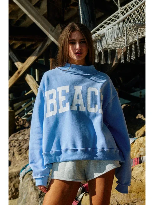 'BEACH' and 'LAKE' Print Reversible Mock-neck Crop Sweatshirt 
- Mock-neck 
- Drop shoulder, long sleeves
- Softest cozy fleece
- Oversized fit
- Cropped silhouette
- Rib banded hemline and cuffs
- The reversible design lets you switch up your style.