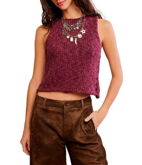 Contemporary
From Free People, this top features:

Sweater knit fabrication
Round neckline
Rolled neckline detail
Sleeveless
Pullover construction
Tank silhouette
Approx. 18.5" length
Cotton/Acrylic