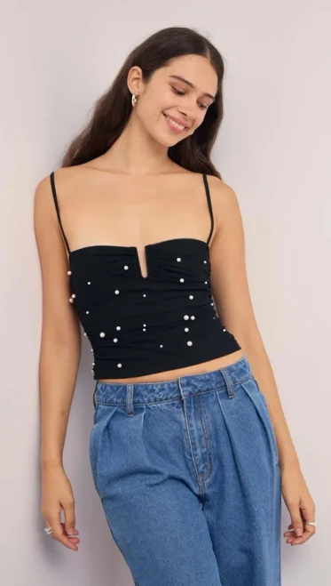 Bring the sparkle with the Stella Mesh Top, a chic update on your classic party cami. Crafted from soft black mesh and adorned with pearl embellishments, it's designed with a flattering sweetheart neckline and ruched detailing that hugs in all the right places. Style it with denim for a playful edge or match it back with the Stella Mesh Mini Dress for a coordinated moment.