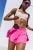 Lightweight, breathable fabrication; sweat-wicking; thick, elastic waistband; low-rise design; shorty silhouette; built-in briefs.
