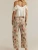 Free Peoples iconic Deep Trance silhouette—now in a perfectly printed design. This fun pair features the fit you know and love with a vintage-inspired print for added charm.

Fit: Low-rise, dropped barrel fit
Feel: Authentic rigid denim
Features: Button-fly closure, five-pocket design, ankle-length inseam