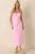 The MINKPINK Gaia Pink Cotton Keyhole Detail Halter Midi Dress brings an effortless blend of femininity and sophistication to any special occasion. Designed in a vibrant bubblegum pink hue, this midi dress features a halter neckline with an adjustable tie closure, a front keyhole detail, and flattering ruched waist detailing that enhances the silhouette. A fitted bodice flows into a sleek midi-length skirt, while a concealed back zipper and back slit provide a comfortable, streamlined fit. Perfect for weddings, vacations, brunches, and summer celebrations, this dress makes a statement while remaining timeless and refined.