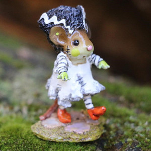 A Wee Forest Folk miniature Halloween figurine of a cute mouse dressed as the Bride of Frankenstein in a white dress, striped stockings, orange shoes, and a tall black hairstyle, walking robotically with arms extended.
