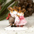 A Wee Forest Folk miniature figurine of two adorable mice in love, standing cheek-to-cheek, wearing a scarf with heart motifs holding them close together.