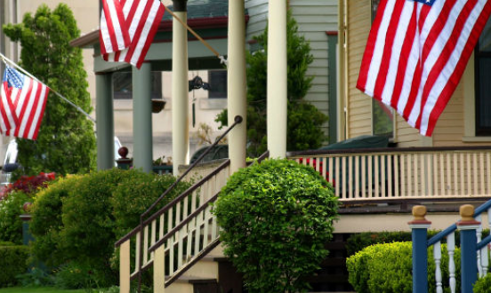 Porches decorated with American Flags