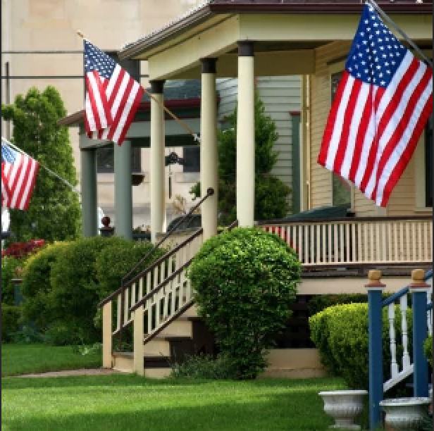 American Flags displayed on a porch 