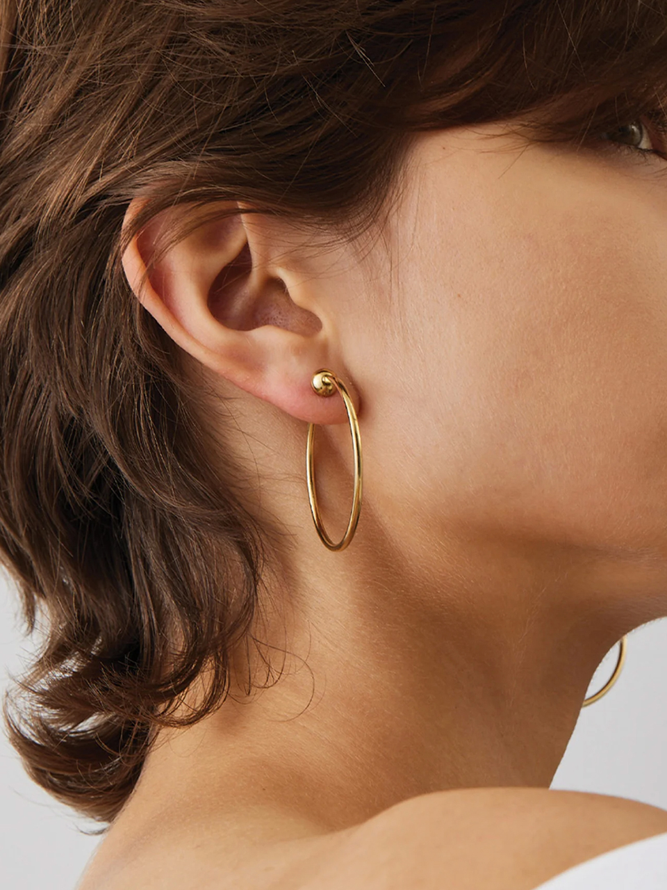 Jenny Bird Small Icon Hoops in Gold on Model 2