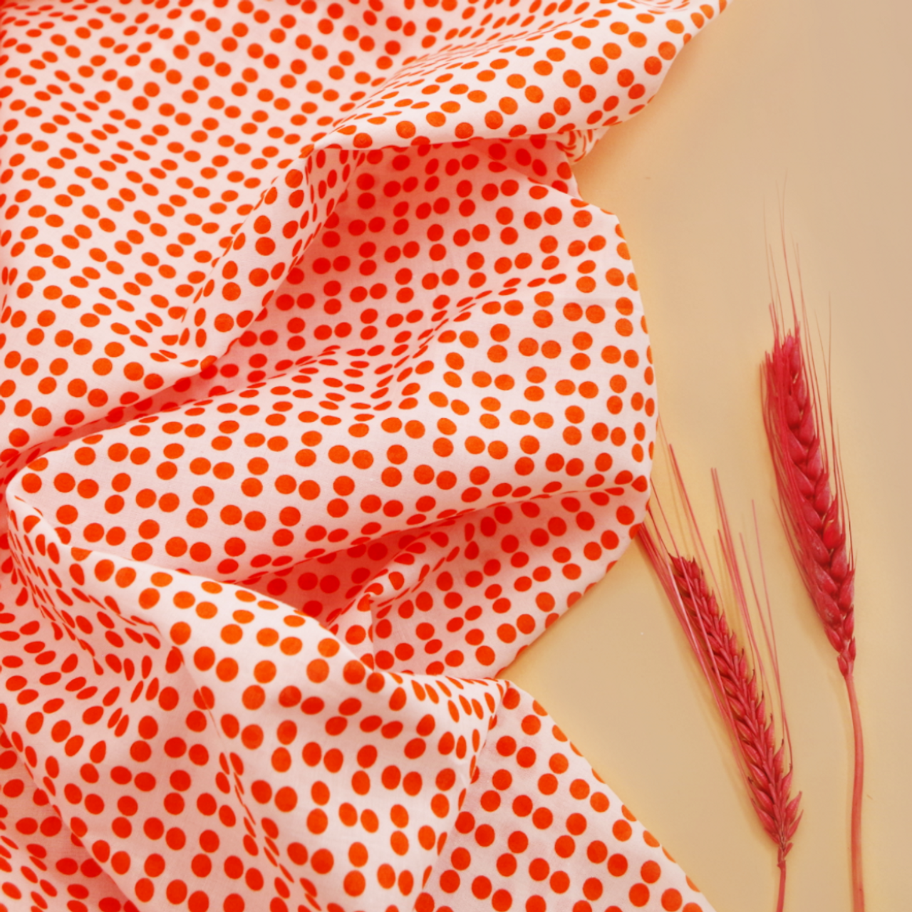 Flower printed red cotton poplin. Designer deadstock fabric cut to length.  Sold by units of 10 cm (1 mt= 10 units)