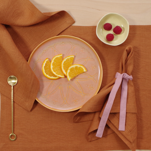 brown tones table setting, burnt napkins and placemats