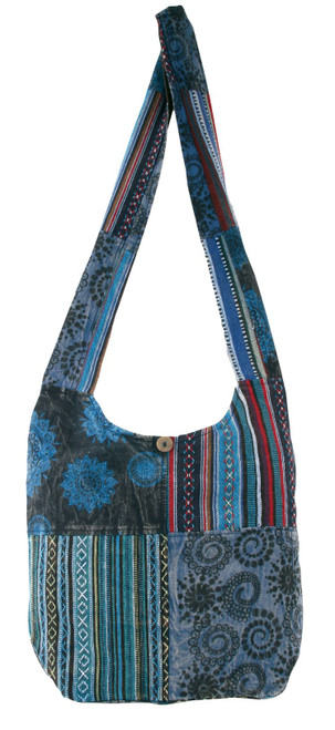 - 100% cotton

- 15" x 13.5"

- Assorted colors

- Patchwork with block printed designs

- Wooden button with zipper closure to main compartment

- Inside zipper pocket
