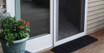 Rubber threshold ramp positioned at doorway entrance, enhancing accessibility for mobility users