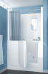 Compact walk-in bathtub with a door, gray curtain, and mirror in a blue bathroom setting