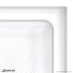 Solid surface shower pan with textured bottom design, white finish, and DreamLine branding