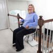 USA-made Bruno Elan SRE-5000 stairlift for straight staircases with folding armrests, safety sensors, and smooth operation designed to improve mobility, independence, and accessibility for seniors and homeowners.