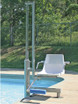 Aqua Creek Mighty Pool Lift with a stainless steel frame and a white seat, positioned at the edge of a swimming pool