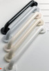 Angled grab bars in various colors, including black, gray, beige, and white