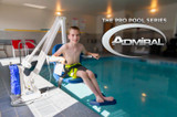 Admiral Pool Lift in use, with a young boy seated on the lift, demonstrating accessibility for pool entry