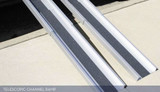 Telescopic channel ramp with textured surface, designed for portability and accessibility