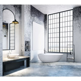 Freestanding Pure Series bathtub in modern bathroom setting with large windows, stylish sink, and contemporary decor