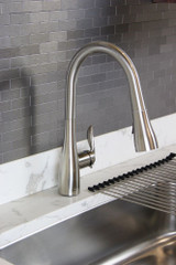 Transolid T3540 Pull-Down Luxe Stainless kitchen faucet installed in a modern kitchen setting with a sleek design