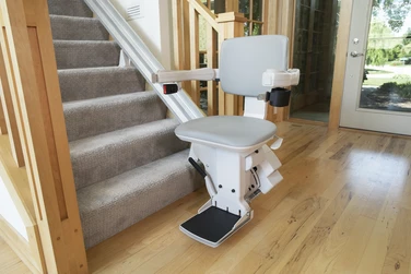 Bruno Electra-Ride Elite stair lift with padded seat and armrests, designed for individuals with mobility challenges