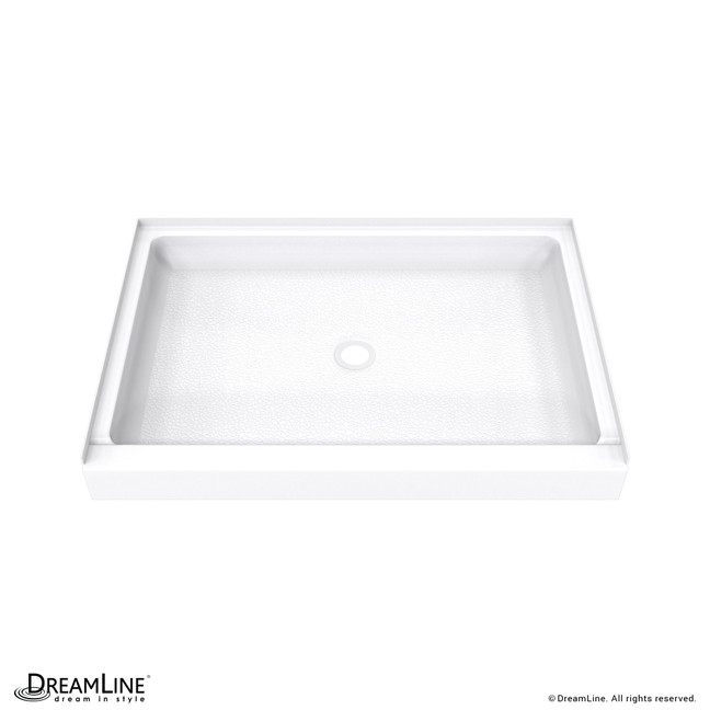 Solid surface shower pan in white, with a center drain and a textured non-porous surface