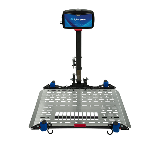 Heavy duty wheelchair lift by Harmar, with a wide platform with blue rollers, designed for vehicle accessibility