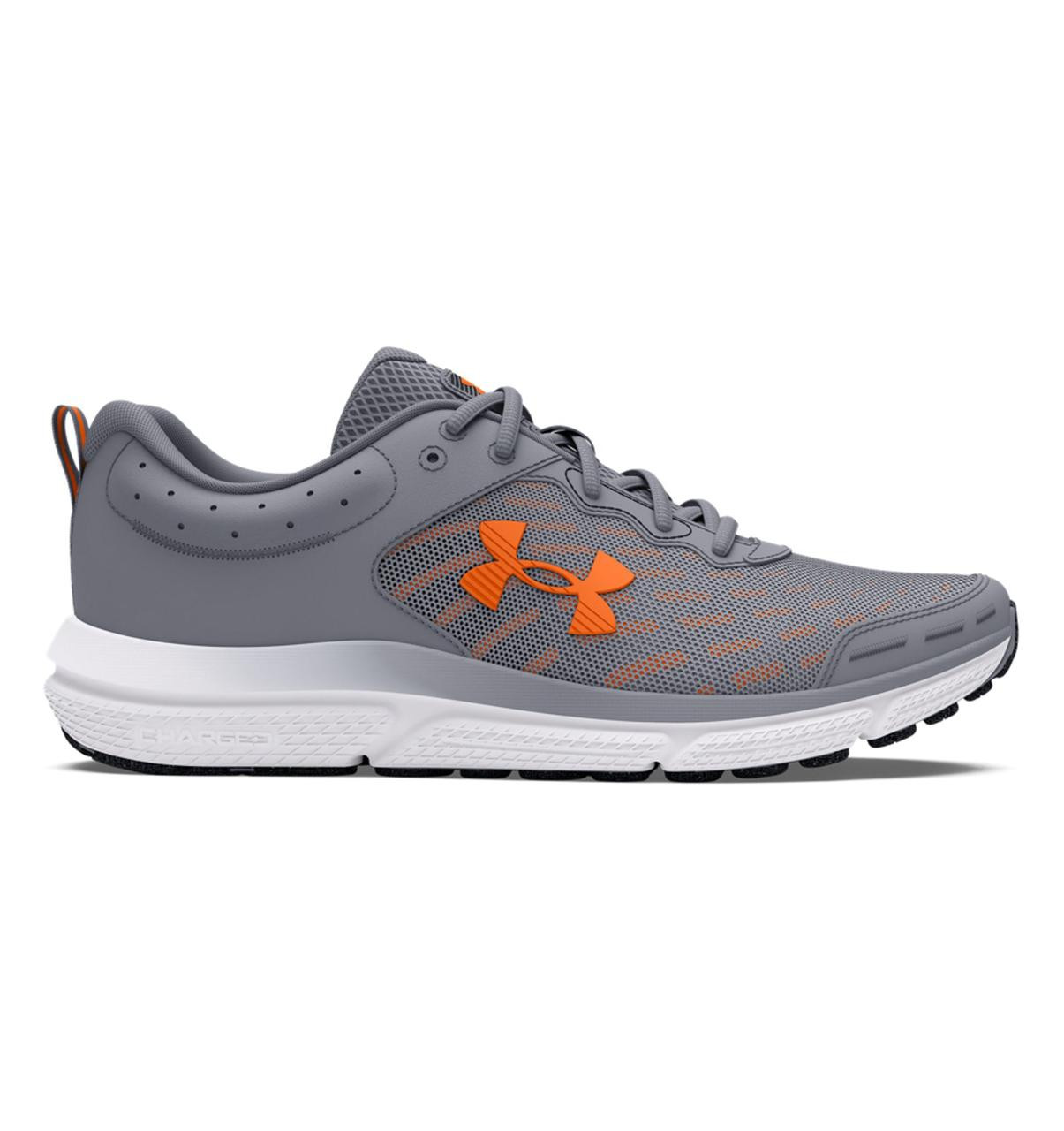 Under Armour Charged Assert 10 Running Shoes, gray athletic shoe with orange logo, mesh upper, cushioned white sole, and black outsole for running and training.