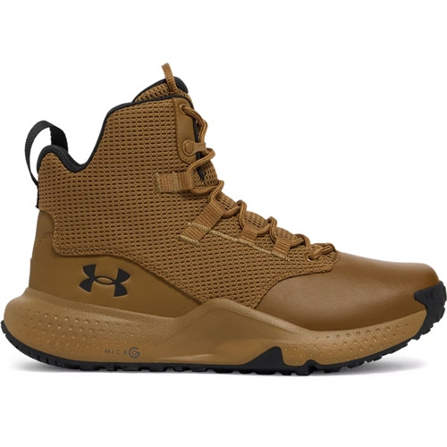 Under Armour UA Micro G Stellar Mid, a tan and black mid-cut athletic shoe with breathable mesh upper, supportive ankle collar, and durable rubber outsole.