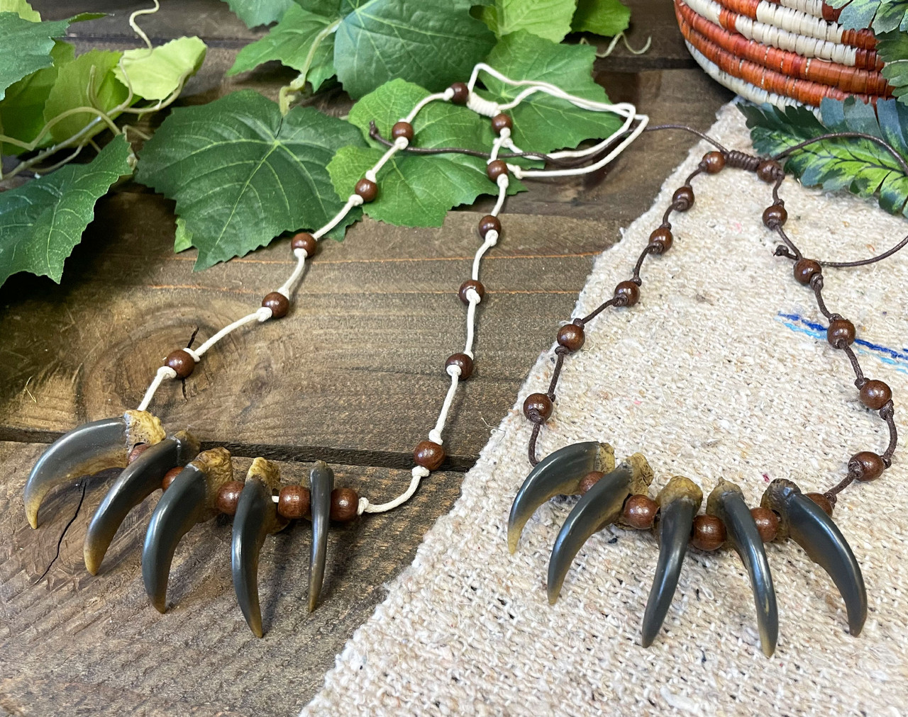 Black bear claws with pearl, turquoise, ceramic, wood, and stone beads