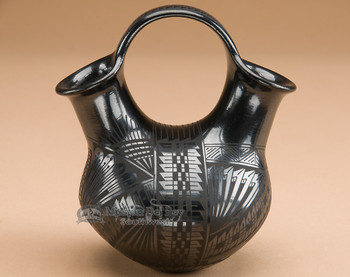 Mata Ortiz polished black wedding vase.