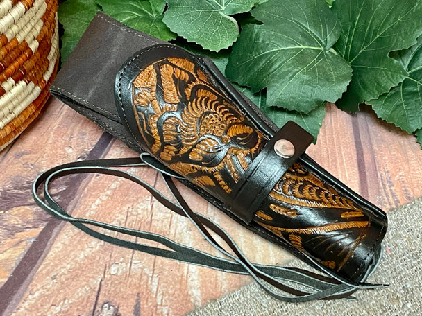 Western left handed tooled leather holster.