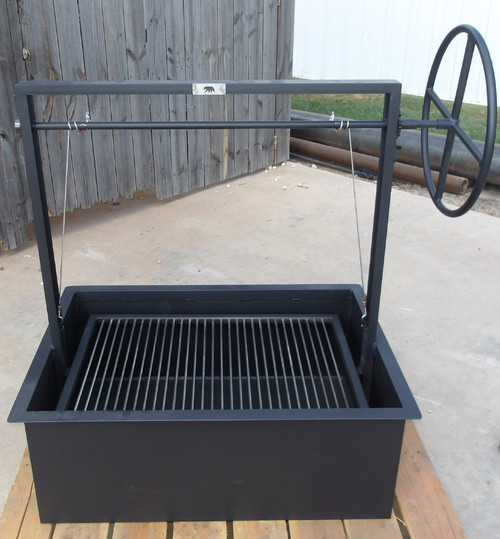 The robust framework of the black steel Santa Maria grill, built for durability and featuring a heavy-duty firebox ready for installation.