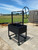Commercial spec wood-fired grill on locking casters with flywheel control.