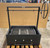 Custom built-in grill, black steel frame, outdoor kitchen appliance
