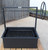 The complete Santa Maria grill system, from the adjustable grate to the side wheel and deep firebox, indicating a premium outdoor cooking experience.