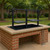 Black steel Split Santa Maria Counter Drop-In Grill installed in a red brick outdoor kitchen island, featuring independent adjustable grates.