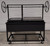 Split Santa Maria Grill with one Grill Grate in the Santa Maria Style Round Rod Grate and one Grill Grate in the Argentine V-Grate with Drip Style.