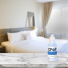 CP Lab Safety CPAP Cleaner Hard-Water Deposit Remover for Humidifier Chambers, Travel Size 20mL Bottles, CPOP Formula, Made in USA, shown on a hotel room counter with a bed and curtains in the background.