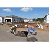 UltraTech Drain Guard, trash and debris 10-pack, on a construction site with workers installing the drain guard to prevent debris from entering the storm drain.
