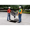 UltraTech Drain Guard, Trash and Debris, 10-Pack - Two workers installing a drain cover in pavement, holding a black drain guard to prevent debris from entering the storm drain.