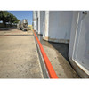 UltraTech Berm Builder (2) Corners, 6-inch, a lightweight orange and white plastic barrier corner for construction or safety barricades, installed along a concrete surface.