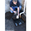 UltraTech Archaea, 90 Billion Sugar, 25 lb. Bag - person testing water quality in an outdoor drain using a test strip.