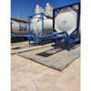 UltraTech Foam Wall Plus Berm, 10' x 10', Copolymer 2000, in blue and white, outdoor foam wall berm installed on gravel surface with industrial tanks in background.