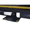 Justrite QuickBerm 14' x 54' x 4" Drive-Through Washdown Spill Containment Berm, 1800 Gallon, Low-Profile for Vehicle & Equipment Cleaning, showing close-up of black spill containment berm with foam padding and drain fitting.